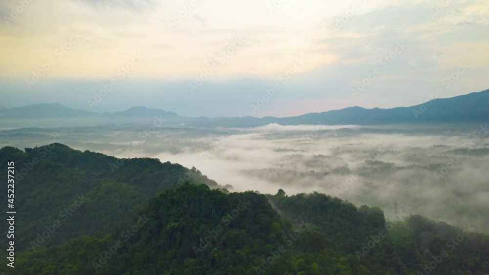 Hyper lapse by Drone, Beautiful Landscape in the morning time
during sunrise with fog above the mountain, White fluffy clouds moving softly on cloudy, Pang puai Mae moh Lampang, Thailand. Hyper lapse by Drone, Beautiful Landscape in the morning time
during sunrise with fog above the mountain, White fluffy clouds moving softly on cloudy, Pang puai Mae moh Lampang, Thailand.
