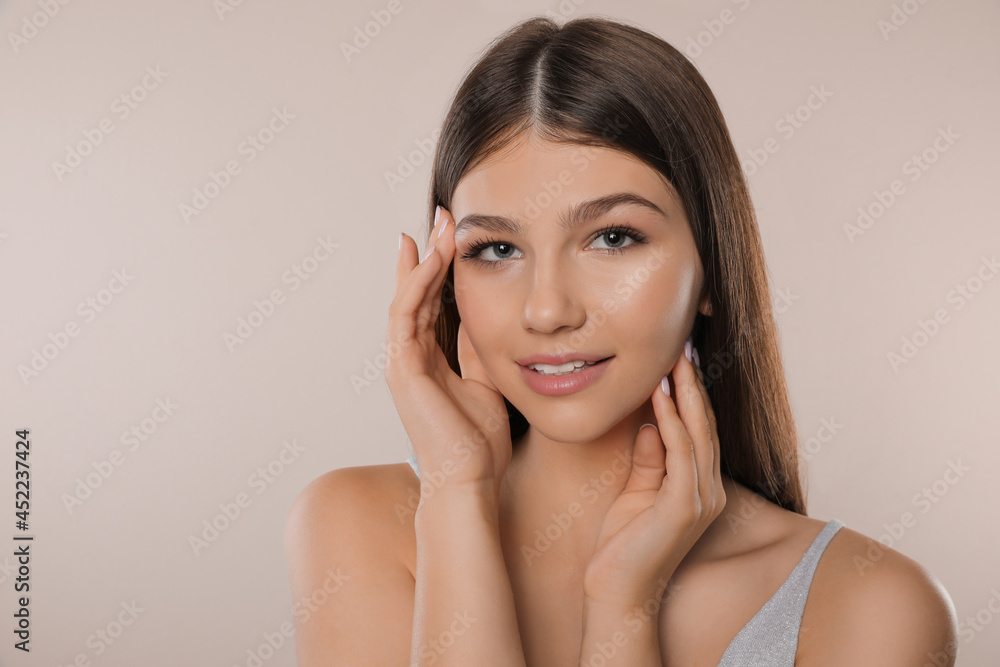 Portrait of pretty girl on light background. Beautiful face with perfect smooth skin Portrait of pretty girl on light background. Beautiful face with perfect smooth skin