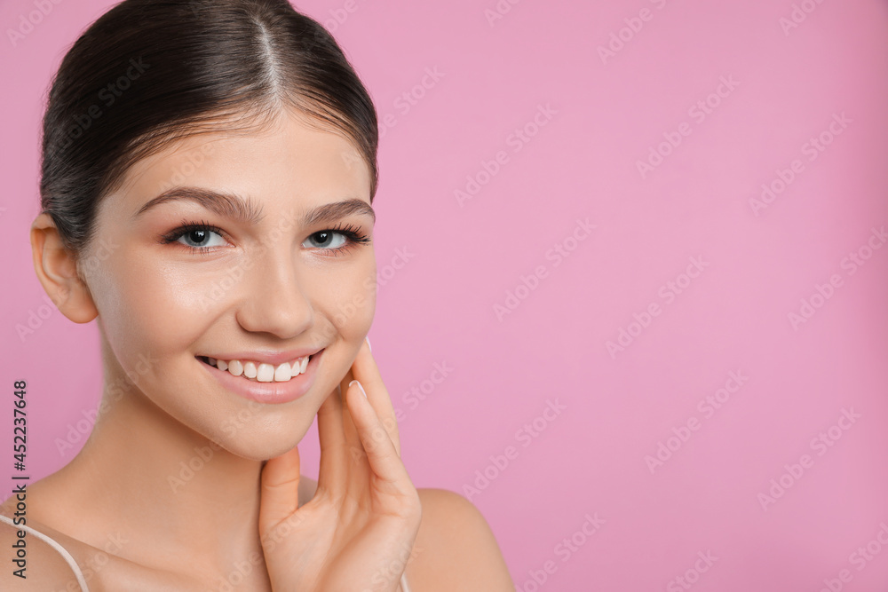 Pretty girl on pink background, space for text. Beautiful face with perfect smooth skin Pretty girl on pink background, space for text. Beautiful face with perfect smooth skin