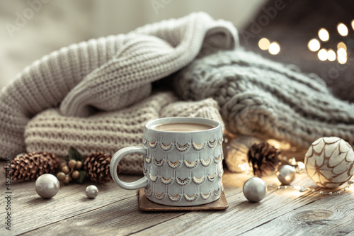 Cozy winter composition with a cup and decor details.
