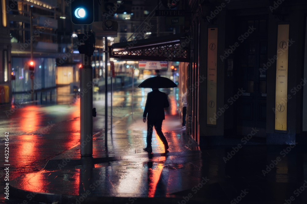 Fototapeta premium silhouette of a person walking in the night
