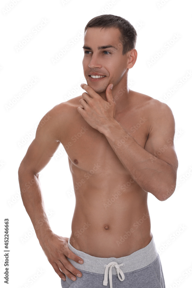 Handsome shirtless man with slim body isolated on white Handsome shirtless man with slim body isolated on white