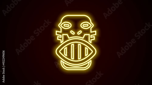 Glowing neon line Mexican mayan or aztec mask icon isolated on black background. 4K Video motion graphic animation
