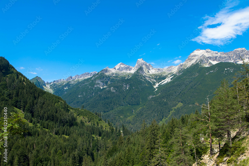 Spectacular panorama view in the middle of the wide, sparsely populated mountain ridge between the Lech and Inntal valleys. Bschlabertal and and Hahntennjoch. Tyrol, Austria.