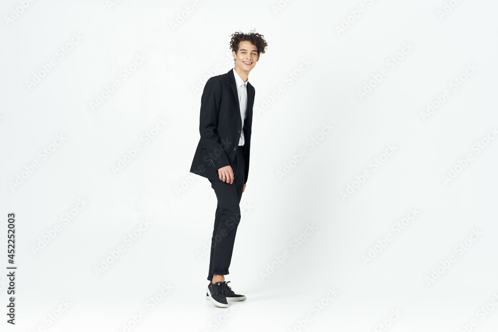 man in suit curly hair self confidence light background man in suit curly hair self confidence light background