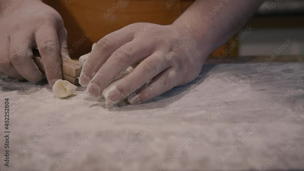 Chef picks gnocchi from the table with spatula
the table is completely floured, gently pick up the pasta to take it to the tray, with the help of a metal spatula Chef picks gnocchi from the table with spatula
the table is completely floured, gently pick up the pasta to take it to the tray, with the help of a metal spatula