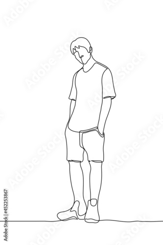 man stands in a T-shirt and shorts his hands in his pockets he tilted his head and looks at the viewer - one line drawing