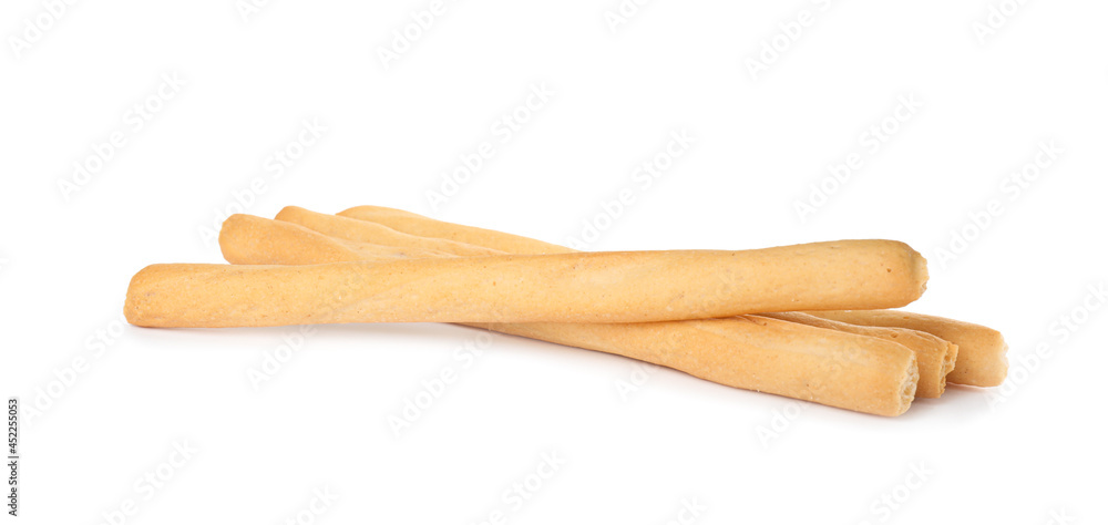 Fresh delicious grissini sticks on white background