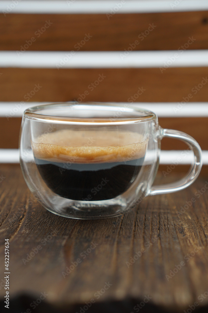 A cup of espresso made using mokapot on a white isolated background A cup of espresso made using mokapot on a white isolated background