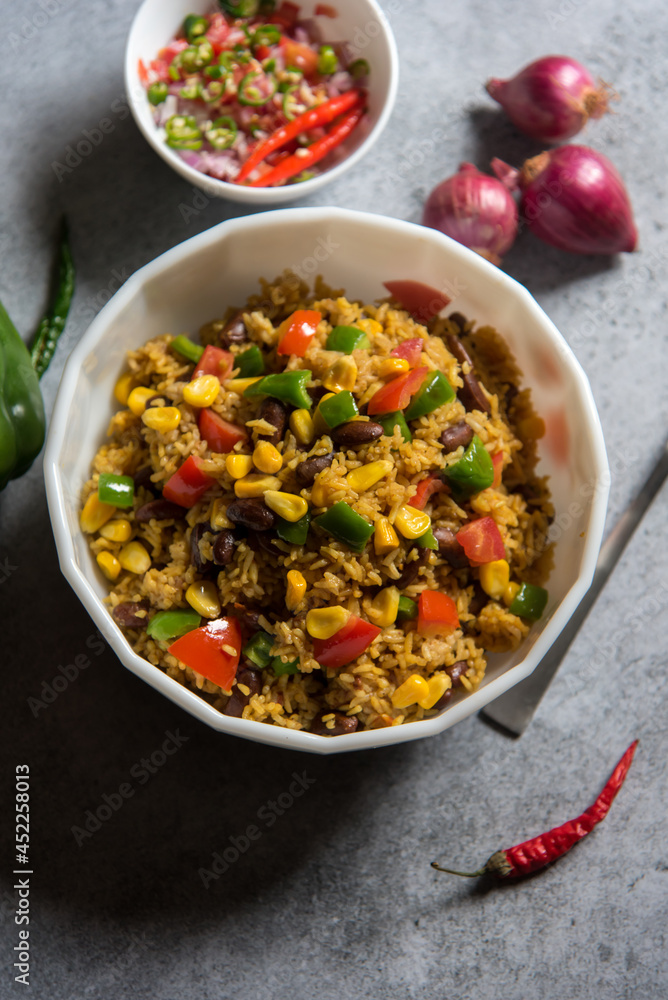 Close up top view of yellow rice or Mexican pilaf in a bowl prepared with meat and vegetables. Close up top view of yellow rice or Mexican pilaf in a bowl prepared with meat and vegetables.