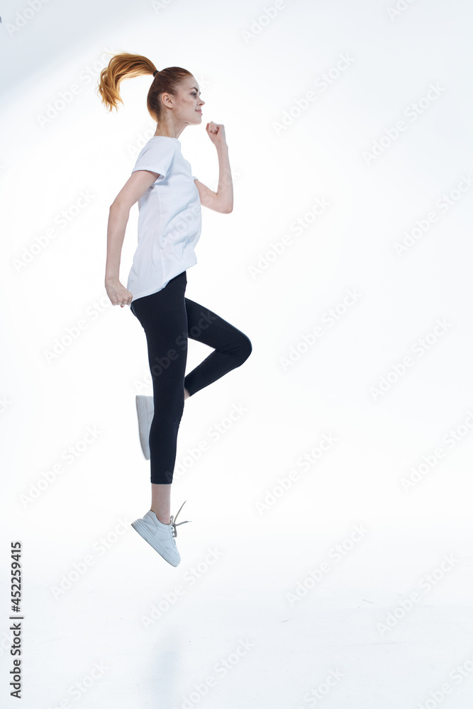 athletic woman in full length caps exercise fitness cardio