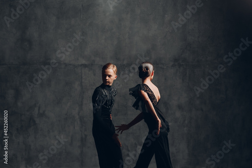 Young couple dancing in ballroom dance Paso doble.