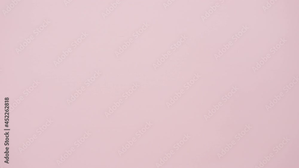 Flat lay. Step by step. Florist arranging a bouquet from pink roses on a pink background. Flat lay. Step by step. Florist arranging a bouquet from pink roses on a pink background.