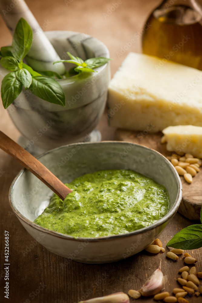 bowl with traditional italian pesto and ingredients bowl with traditional italian pesto and ingredients