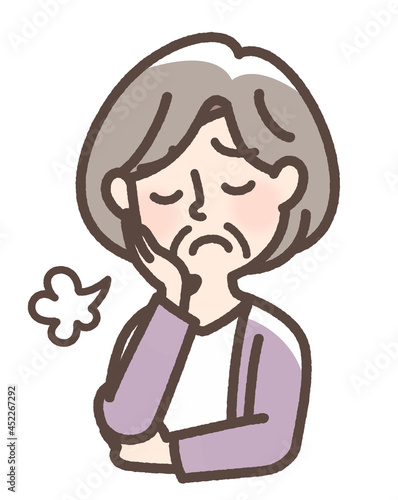 溜息をつくおばあさん