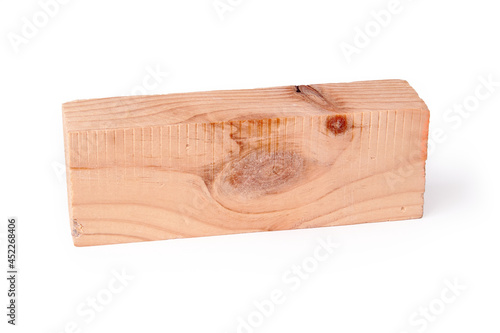Trimmed and treated wood block with texture and knot. Carpentry.