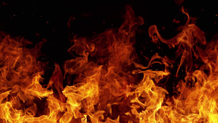 Texture of flames isolated on black background. Fire and fiery element.