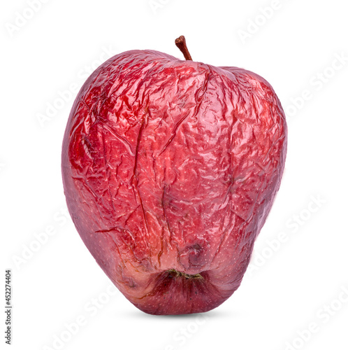 red apple withered on white background