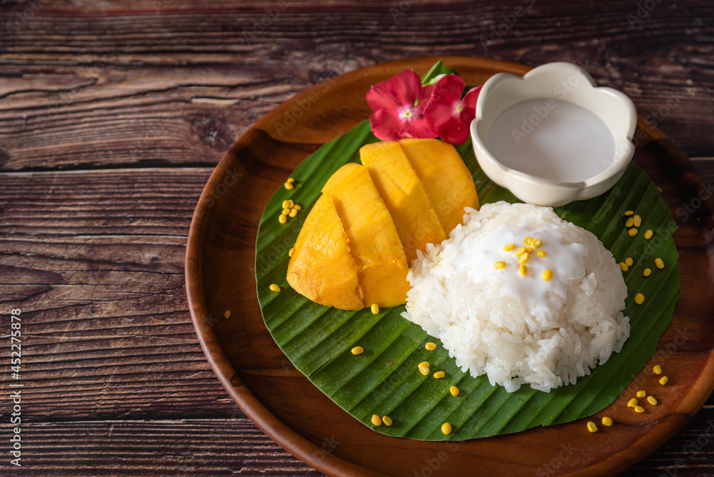 Thai sweet sticky rice on wooden table, Thai traditional dessert, street food for traveler Thai sweet sticky rice on wooden table, Thai traditional dessert, street food for traveler