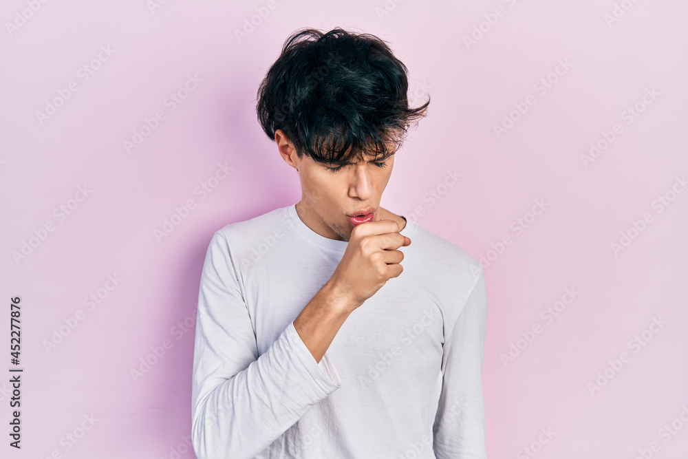 Handsome hipster young man wearing casual white shirt feeling unwell and coughing as symptom for cold or bronchitis. health care concept. Handsome hipster young man wearing casual white shirt feeling unwell and coughing as symptom for cold or bronchitis. health care concept.