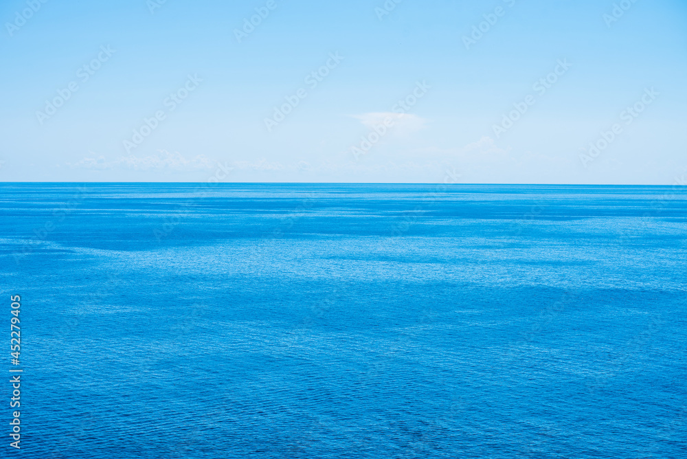Beautiful colorful seascape. Blue water and blue sky at sunny day