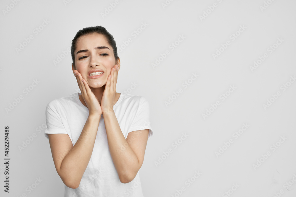 woman with toothache in white t-shirt dissatisfaction health problems woman with toothache in white t-shirt dissatisfaction health problems