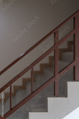 Stairway with brown metallic banister interior modern business office building or home and living architecture decoration design contemporary.