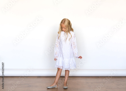 Wallpaper Mural Beautiful girl in a white dress on isolated white background. Blonde with long hair. Emotions. Torontodigital.ca