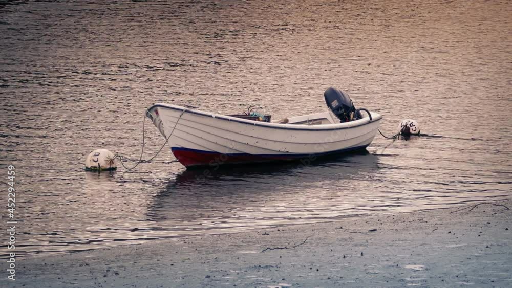 Boat Moored In The Bay At Sunset Boat Moored In The Bay At Sunset