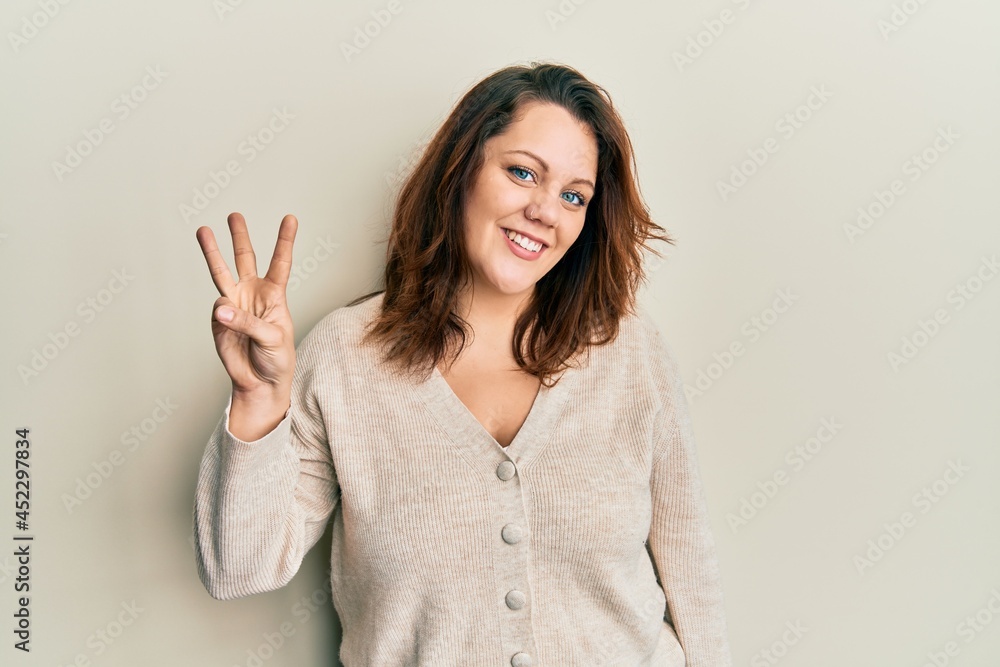 Young caucasian woman wearing casual clothes showing and pointing up with fingers number three while smiling confident and happy. Young caucasian woman wearing casual clothes showing and pointing up with fingers number three while smiling confident and happy.