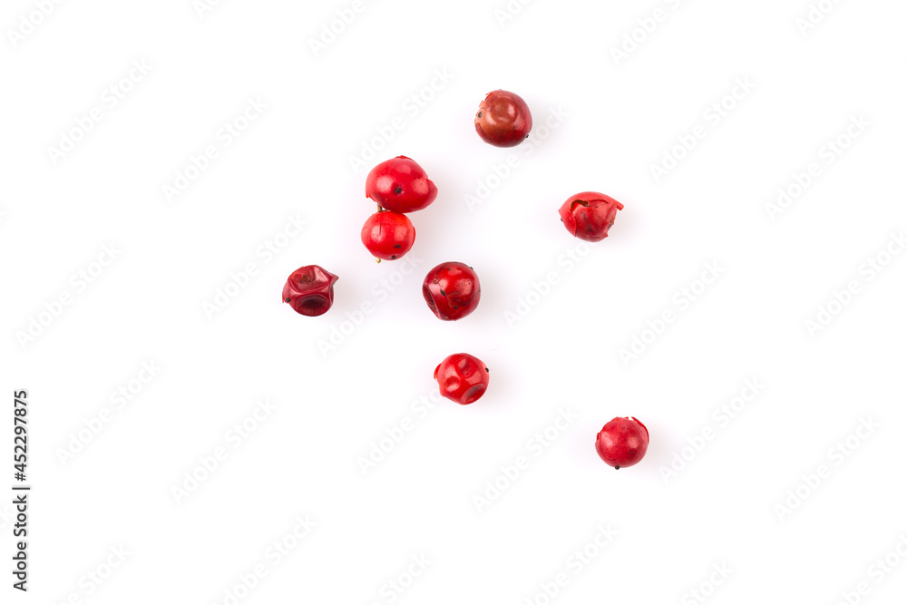 red peppercorns on white red peppercorns on white