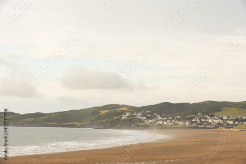 Beach view across the sand with sea shore and seaside town