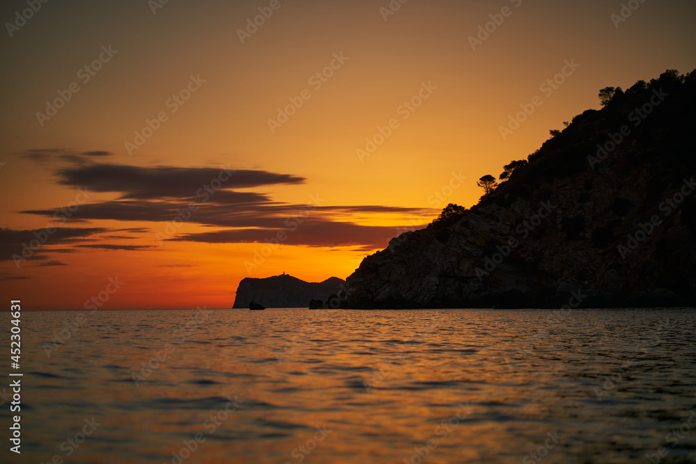 Landscape of sunset over Dragonera island from waters of Port d'Andratx