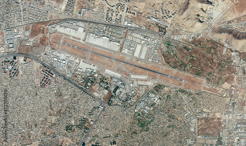 Satellite view of Kabul airport, Hamid Karzai International Airport, houses, streets and buildings in the neighboring area. Evacuation of refugees, Afghanistan. Nasa image photo