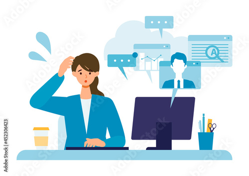 Multitasking businesswoman working on computer.