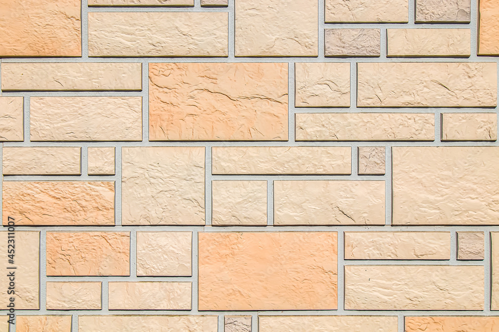 Naklejka premium Artificial stone on the wall as background