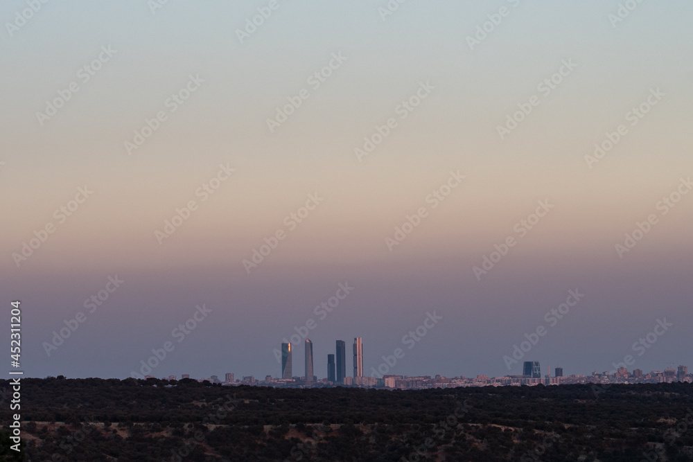 Visible air pollution over the Four Towers Business area skyscrapers of Madrid. Visible air pollution over the Four Towers Business area skyscrapers of Madrid.