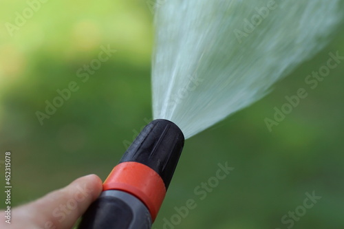 Close up of a splashing garden hose