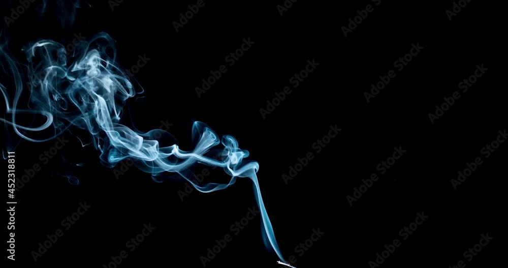 Thin Flexible Trickle of Smoke. Graceful Bends of the Blue Smoke. Natural Colorful smoke rises up and spins into graceful spirals. Footage is perfect for the layer with different blending modes. Thin Flexible Trickle of Smoke. Graceful Bends of the Blue Smoke. Natural Colorful smoke rises up and spins into graceful spirals. Footage is perfect for the layer with different blending modes.