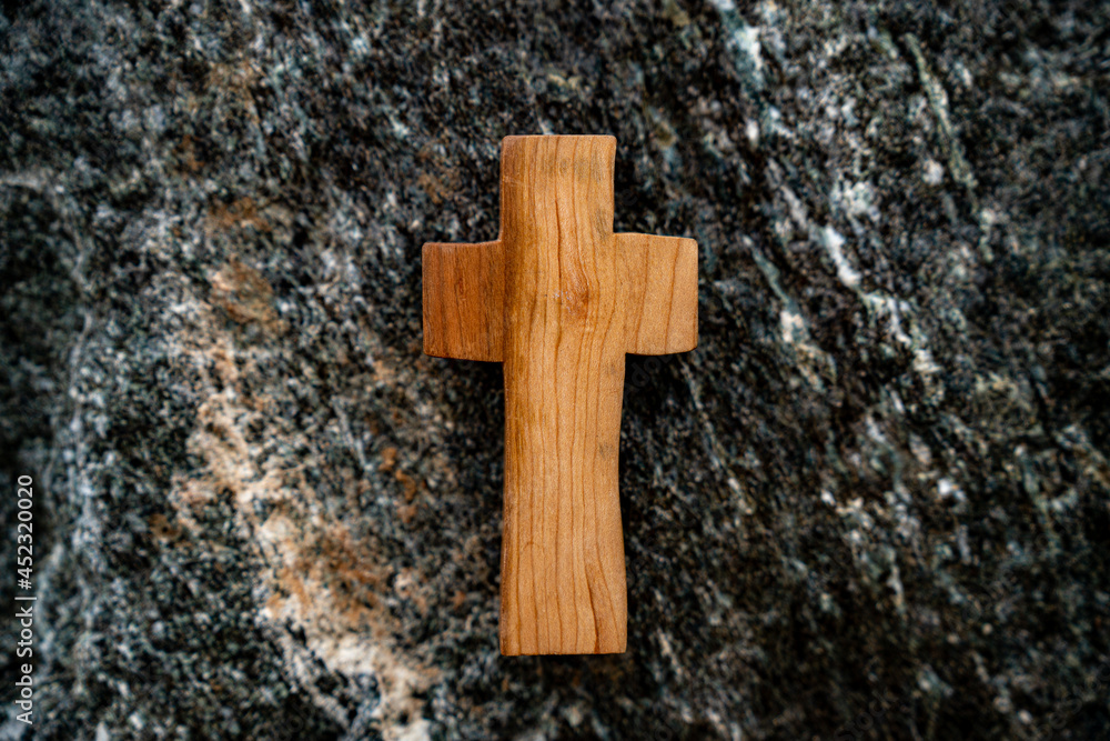 Against the backdrop of a rock section, Wooden Cross.