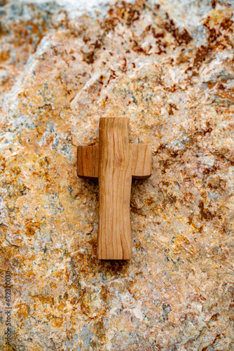 Against the backdrop of a rock section, Wooden Cross. photo