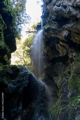Narrow gorge with waterfall, Wilson Creek, Haast Pass, West Coast, South Island, New Zealand