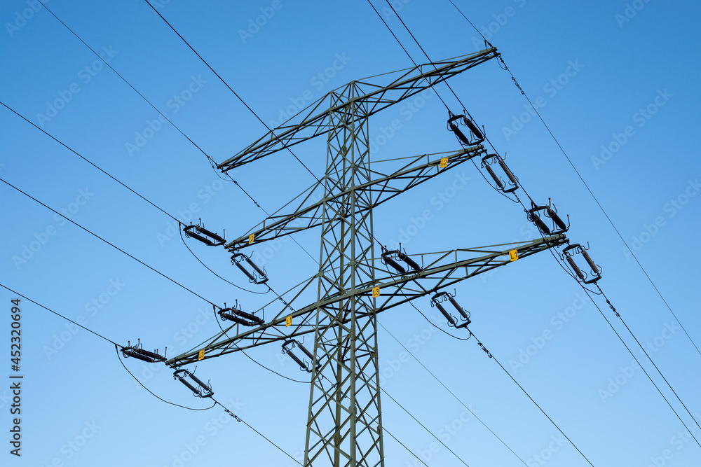 Power line pylon against blue sky Power line pylon against blue sky