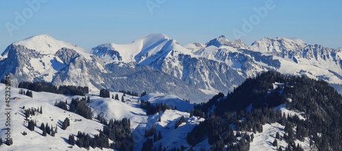 Winter landscape seen from Horneggli, Switzerland. Snow covered mountain ranges.