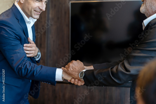 Two successful business people in a joint venture meeting. business, people, investment concept