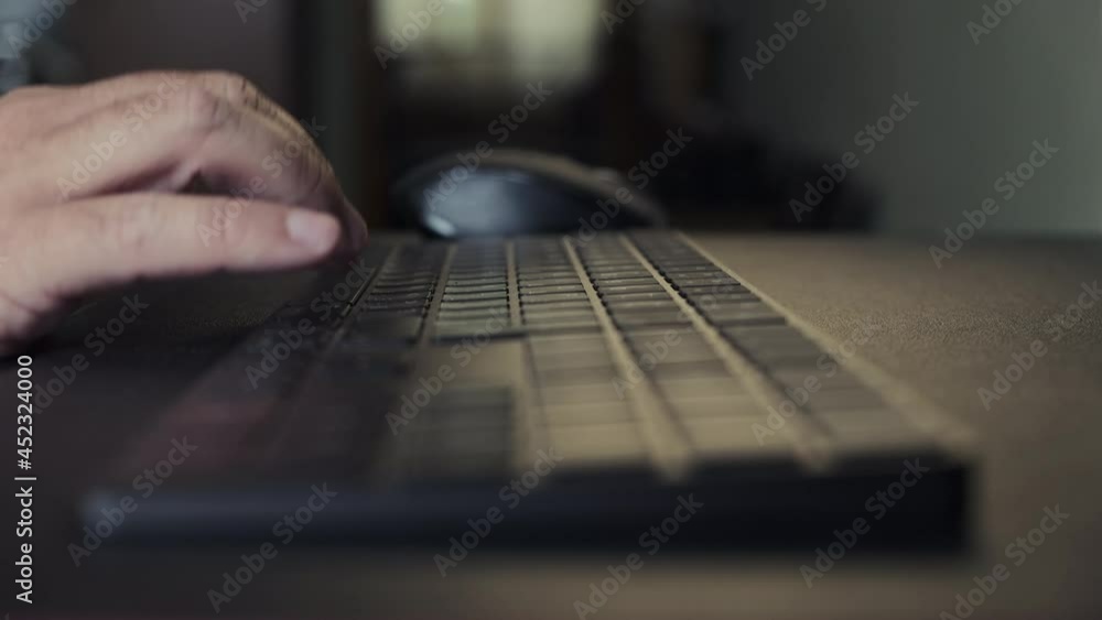 Male hands of man professional user worker using typing on keyboard Male hands of man professional user worker using typing on keyboard