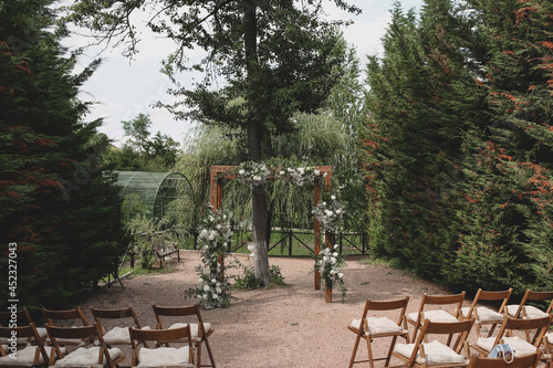 Wallpaper Mural Rustic wedding arch for an ceremony decorated with white and flowers. Torontodigital.ca