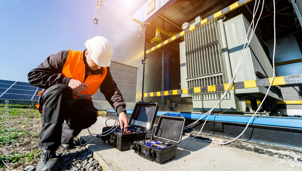 Fototapeta premium Execution of electrical measuring works on the power transformer