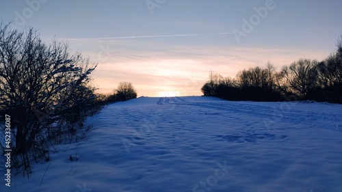 Winter sunset over hill