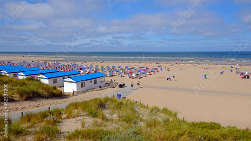 The beach at Katwijk aan Zee on a beautiful summer day in the Netherlands photo